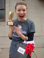 Mandi Duncan, a member of the wait staff at Suzette's Creperie and a student at Wheaton College, won the "Waiter's Race" at Downtown Wheaton Association's First Annual Chili Cook Off.